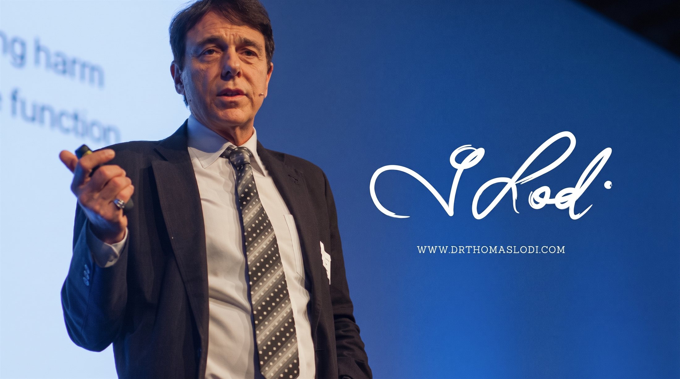 Dr. Lodi speaking on stage